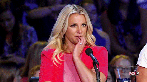 Animated GIF of a woman resting her hand on her chin, looking moved