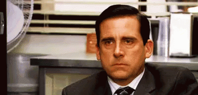 Animated GIF of Michael Scott from The Office staring blankly, looking unamused